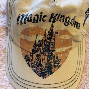 Disney Magic Kingdom Cream Baseball Hat with Navy and Orange Graphic